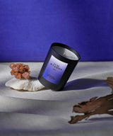 still life candle sacred french luxury perfume and vanities with wood end on blue background